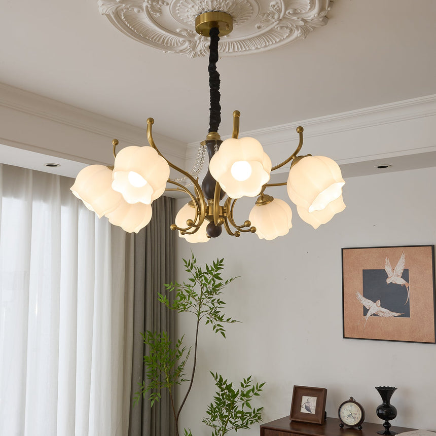 The shades lit above a wood sideboard with a framed print behind