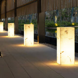 A run lit along a paved terrace with veining showing in each body