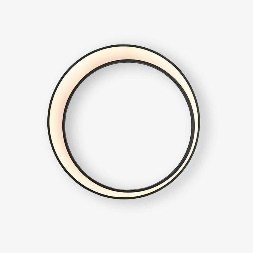 Large black ring garden wall light with a lit crescent of warm light inside