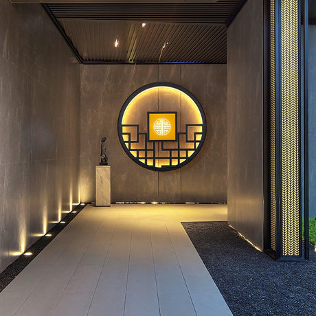 The round light at the end of a covered corridor above a pale stone path