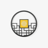 Large round outdoor wall light, a black lattice ring around a glowing square center panel