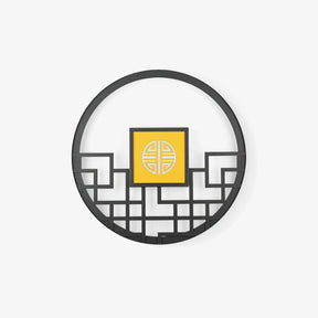 Large round outdoor wall light, a black lattice ring around a glowing square center panel