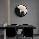 Sconce lit on a dining room wall above a dark table with four chairs