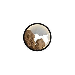 The pale wood relief version seen from the front inside its dark ring