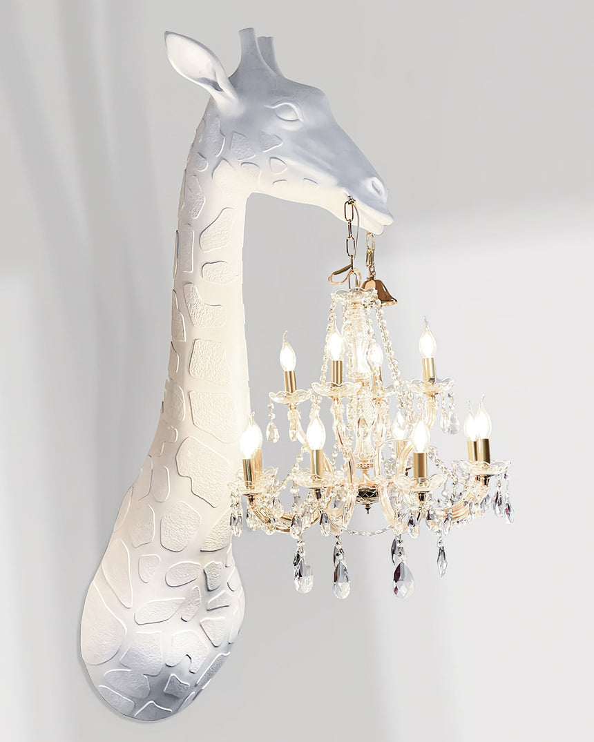 Side view of the white giraffe and the crystal chandelier hanging from its mouth