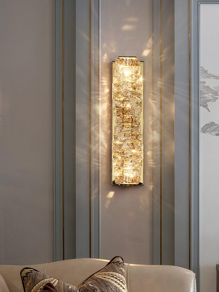 The gold version lit on a paneled wall above an armchair