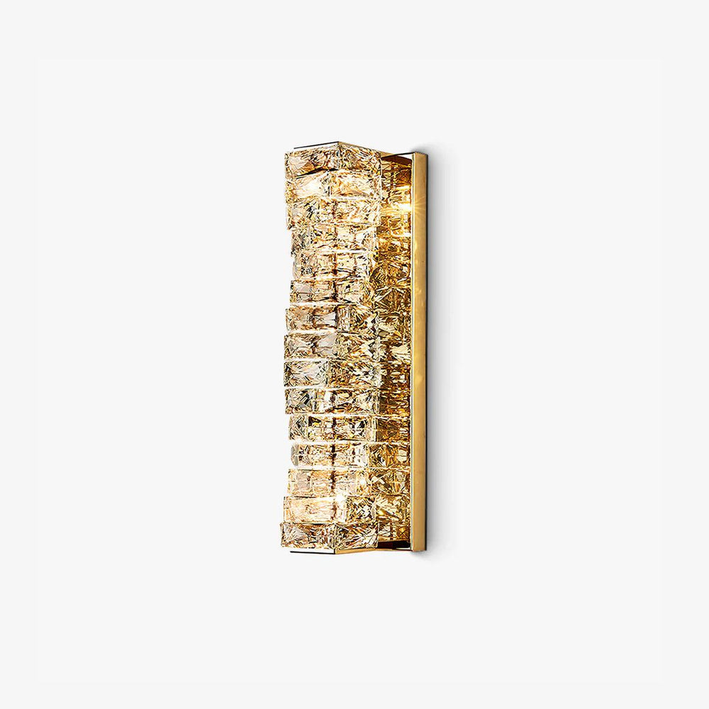 Tall gold wall light faced with stacked rows of cut crystal blocks