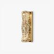 Tall gold wall light faced with stacked rows of cut crystal blocks