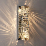 The tallest size lit, light streaming out between the crystal rows