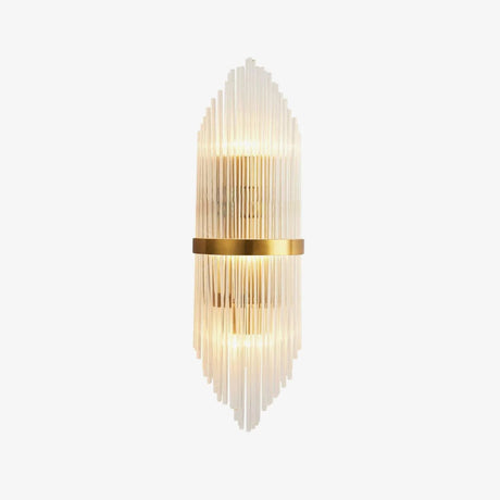 Tall wall sconce of clear crystal rods around a brass band, lit up and down