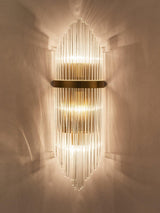 The rods lit warm, light spreading up and down the wall