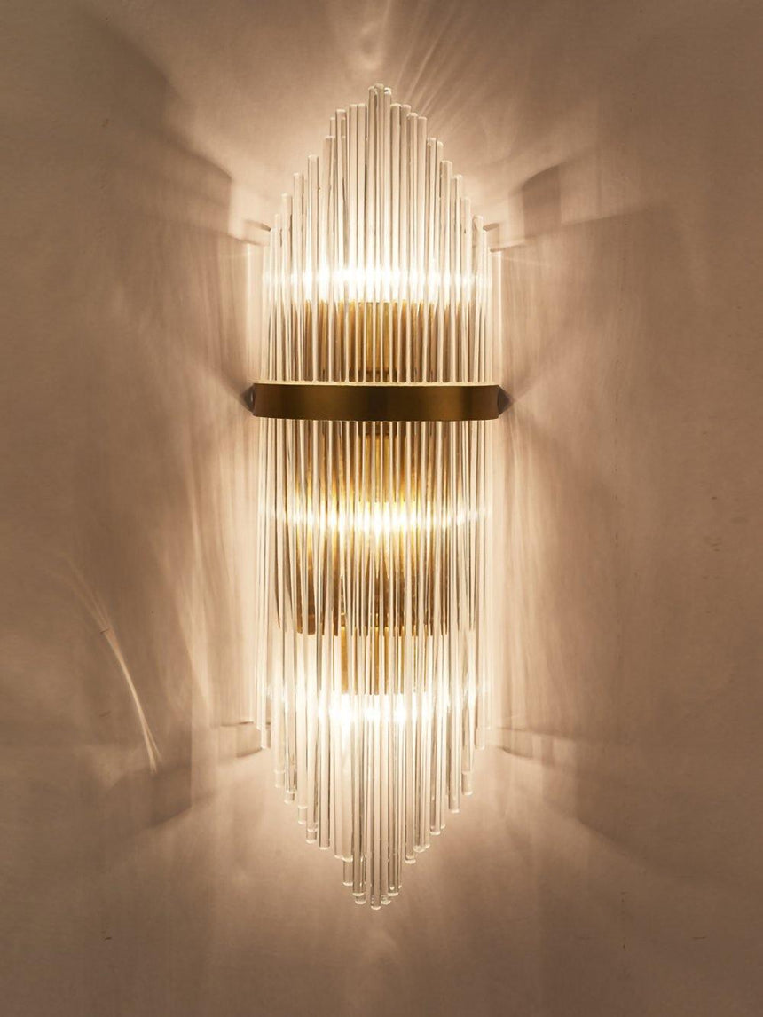 The rods lit warm, light spreading up and down the wall