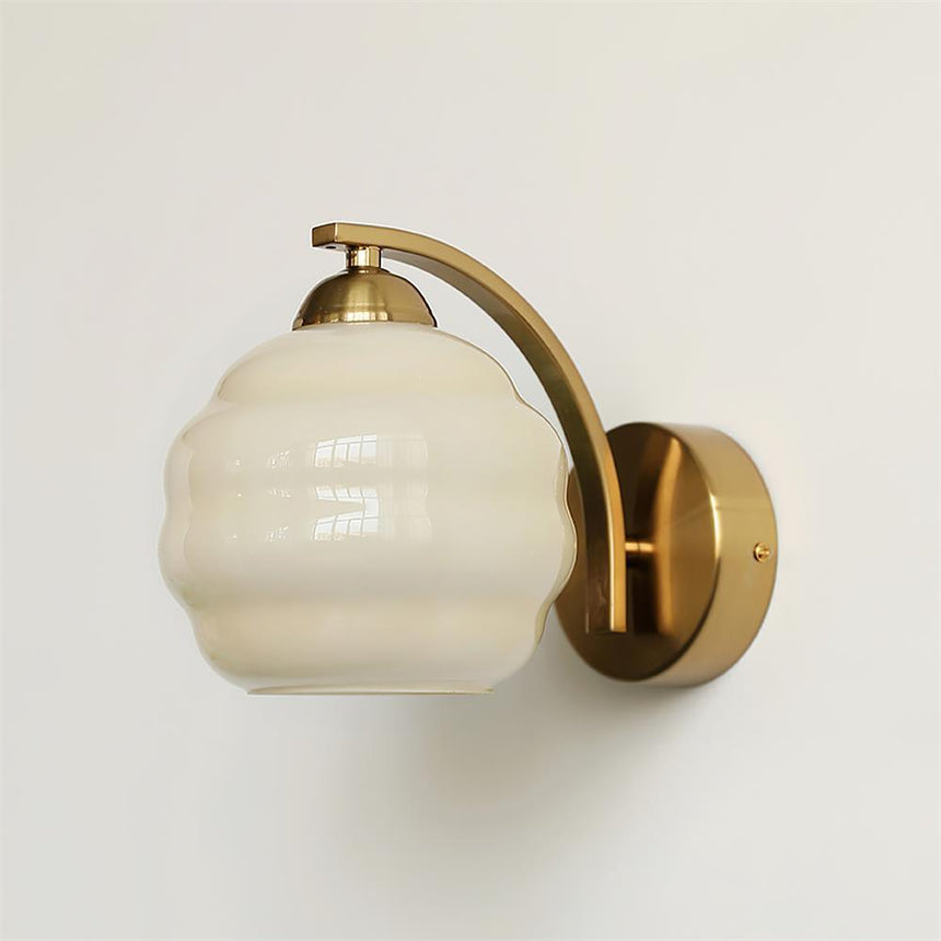 The gold version with a beige ribbed glass globe
