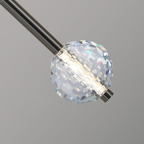 Close view of the faceted crystal ball and the metal stem