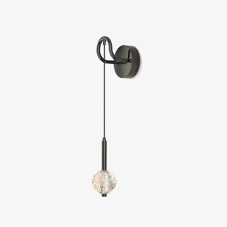 Dark metal wall sconce with a curved hook, a long cord and a faceted crystal ball