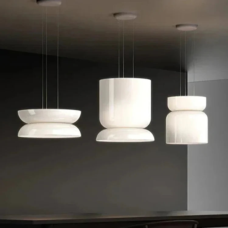 Four of the nine jade glass shapes shown side by side on a dark background
