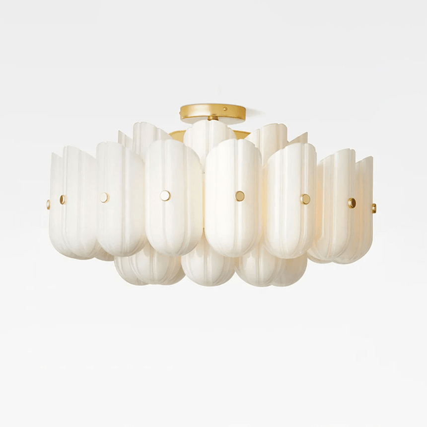 Glass semi flush mount ceiling light with layered white fluted panels and a brass body