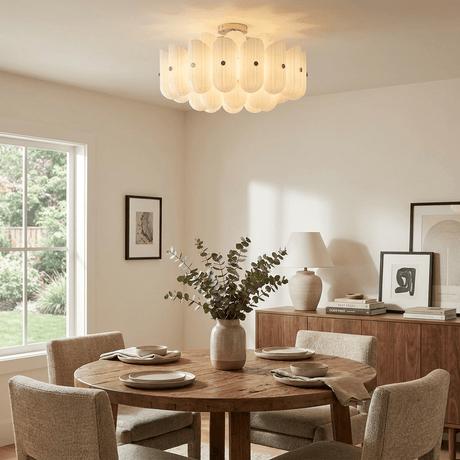 Fluted glass semi flush ceiling light above a round dining table with woven chairs