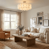 Fluted glass semi flush light in a living room with framed art and a wood table