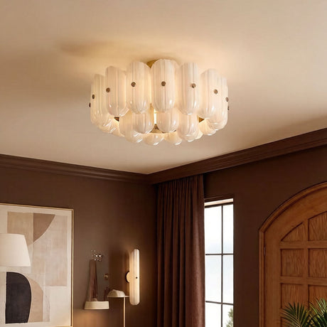 Fluted glass ceiling light in a room with dark red walls and an arched door