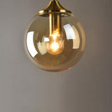 Smoke glass detail on brass wall light