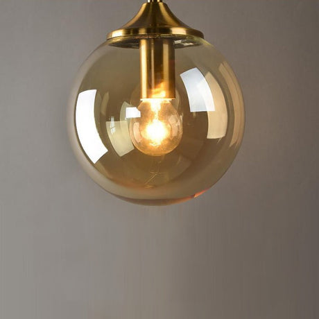 Smoke glass detail on brass wall light