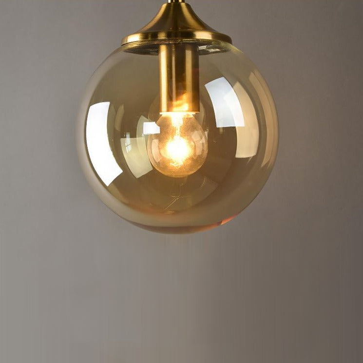 Smoke glass detail on brass wall light