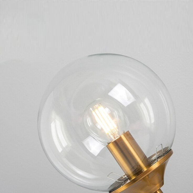 Frosted glass finish on brass sconce