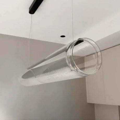 The clear tube seen from below against a white ceiling at an angle