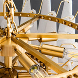 The gold frame with its ring of sockets and bulbs above the stone petals
