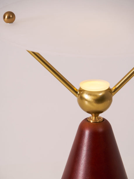 Close view of the brass arms and the balls at their tips