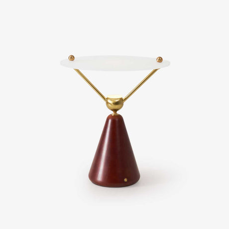 Gold and white table lamp with a floating disc on brass arms, plain ground
