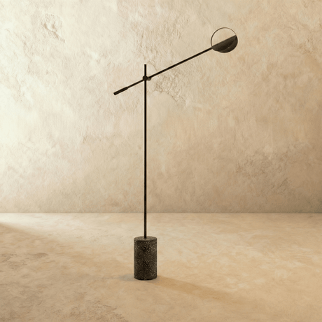 The point where the long arm crosses the upright and the short tail balances it