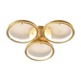 Smaller three ring gold ceiling light on a white backdrop