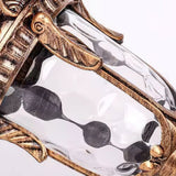 Close view of the water glass shade and the carved rim