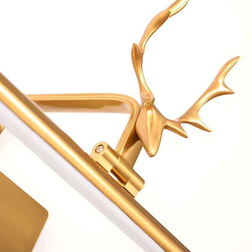 Close view of the cast gold stag head and antlers seated on the tilting bar