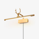 Gold bar with a cast stag head, the cord dropping from the plate down the wall