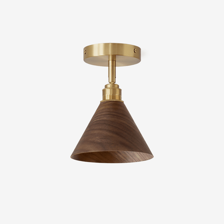 Gold semi flush mount ceiling light with a walnut cone shade and brass canopy