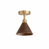 Walnut cone ceiling light seen at an angle against a plain background