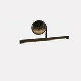The black version seen at an angle, a dark bar under a round black wall plate