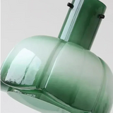 Close view of the green glass shade and its metal collar