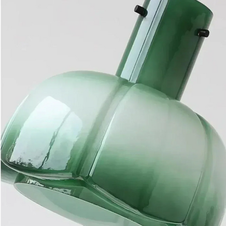 Close view of the green glass shade and its metal collar