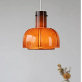 The orange shade shown on its own against a pale wall