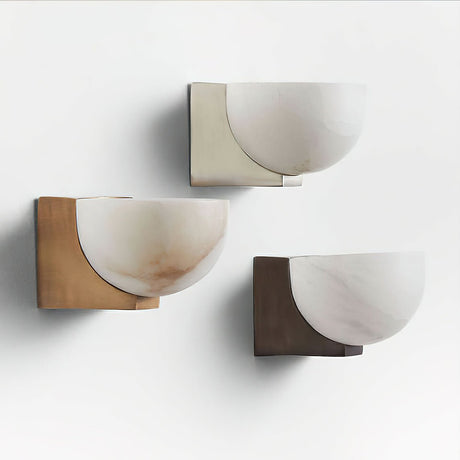 The three finishes unlit side by side, showing the stone and the plates