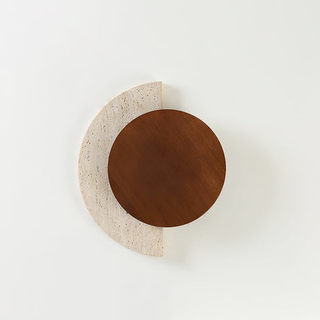 Walnut disc over a travertine crescent unlit, seen straight on