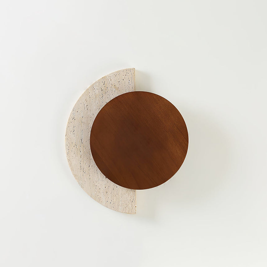 Walnut disc over a travertine crescent unlit, seen straight on