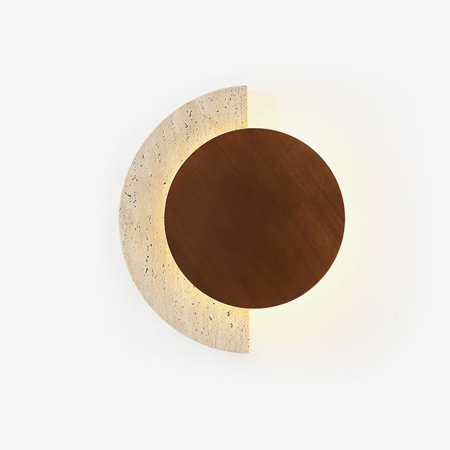 Half moon wall sconce with a travertine crescent behind a walnut disc