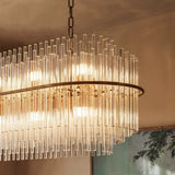 The round version lit in a room, glass rods hanging in two tiers from a ring