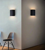 Wall mounted resin lamp with sleek finish