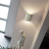 Painted resin wall light fixture